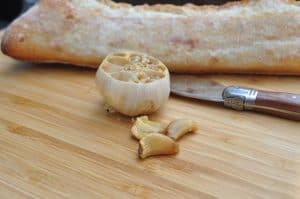 smoked garlic near a loaf of bread