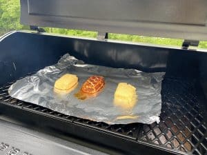 smoked blocks of cream cheese smoking on grill