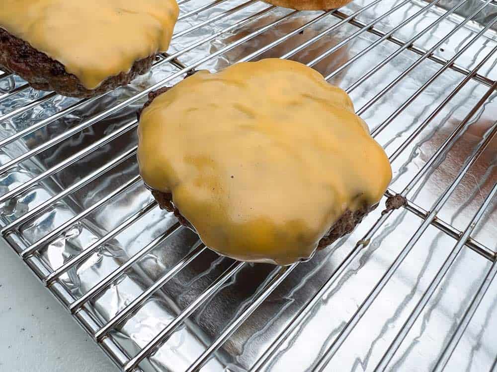 Pit Boss cheeseburgers on a wire rack