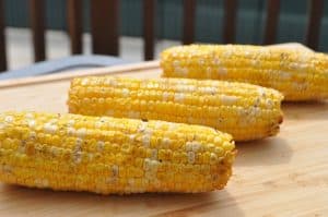 pit boss smoked corn on the cob on a cutting board