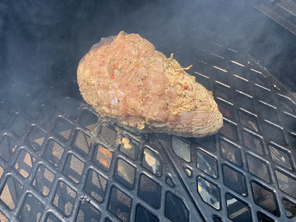 a boneless turkey breast smoking on a pit boss pellet grill