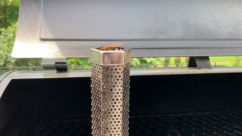 a pellet tube smoker just lit with a flame