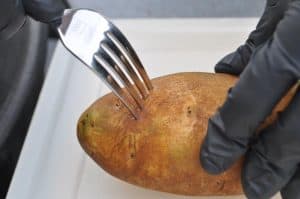 piercing a potato before smoking