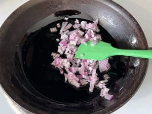 sauteeing onions in a pan