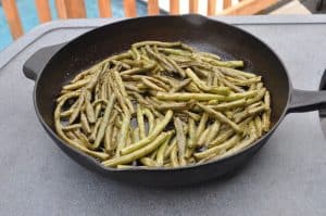 smoked green beans in a cast iron skillet