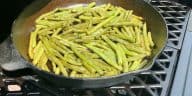 smoked green beans in a cast iron skillet