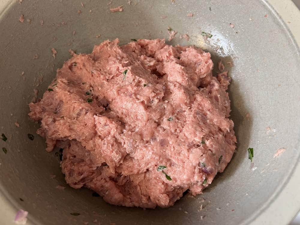 raw ground turkey and spices in a bowl