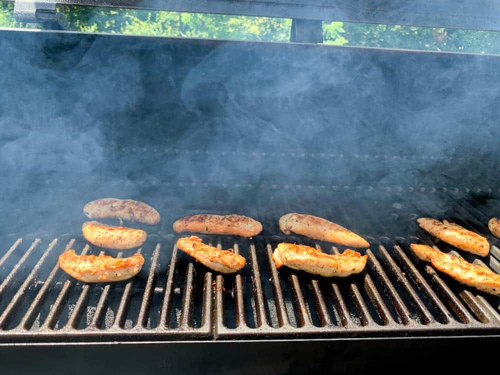 smoking chicken tenders on a grill
