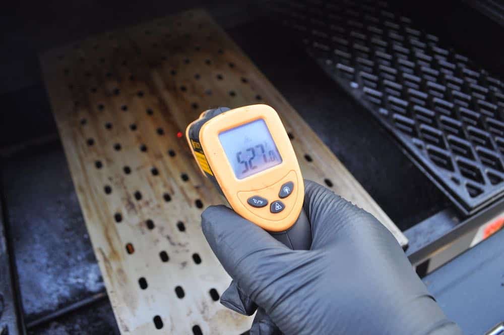 checking surface temperature of grill grates on a pellet grill