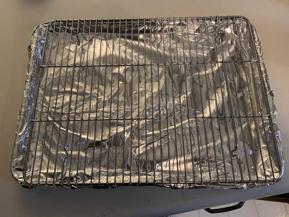 a wire rack on a foil lined baking sheet