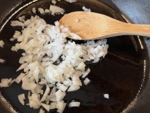 sauteeing onions in a cast iron skillet