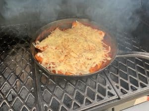 chicken enchiladas smoking in a smoker