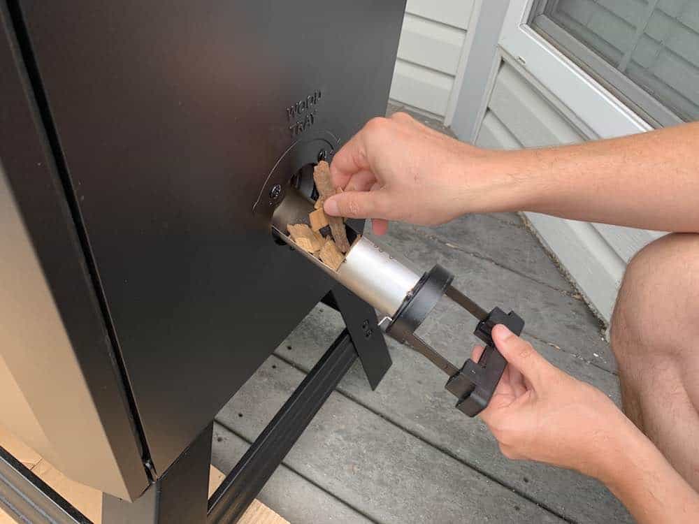 putting wood chips in a masterbuilt electric smoker