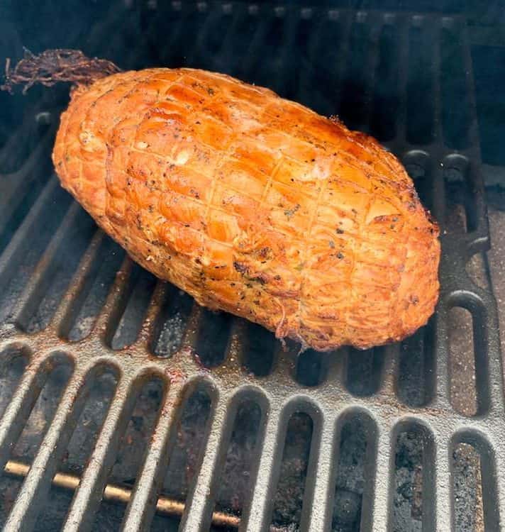 a traeger smoked boneless turkey breast cooking