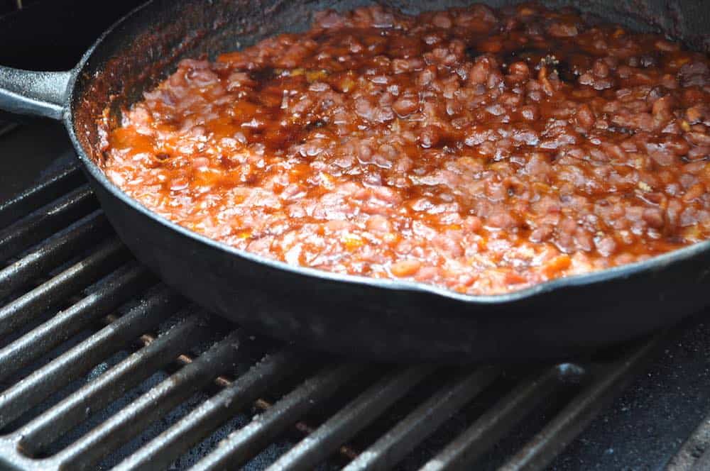 smoked baked beans cooking on a traeger pellet grill