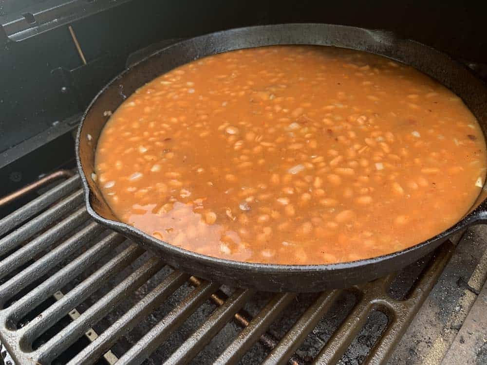 baked beans smoking on a traeger pellet grill