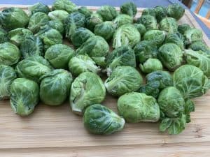 raw brussel sprouts on a cutting board