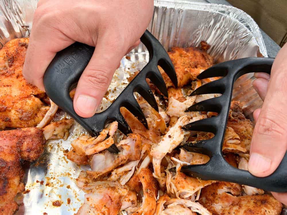 shredding chicken for smoked pulled chicken with bear claws