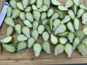 halved brussel sprouts on a cutting board