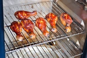 smoked chicken legs in an electric smoker