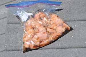 chicken marinating in a bag with honey garlic marinade