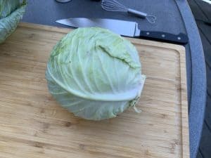 a whole head of cabbage with the outer leaves removed