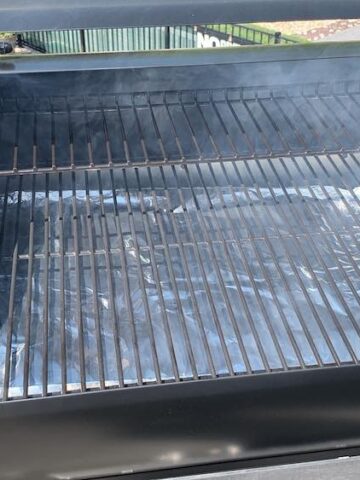 white start up smoke coming out of a z grills pellet grill