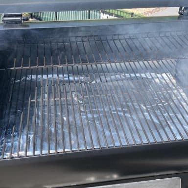 white start up smoke coming out of a z grills pellet grill