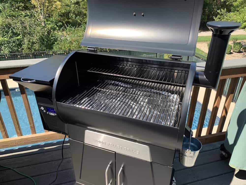 an empty z grills pellet grill with the lid open