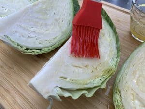 basting olive oil on cabbage to smoke