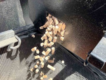 pellets falling out of hopper into bucket