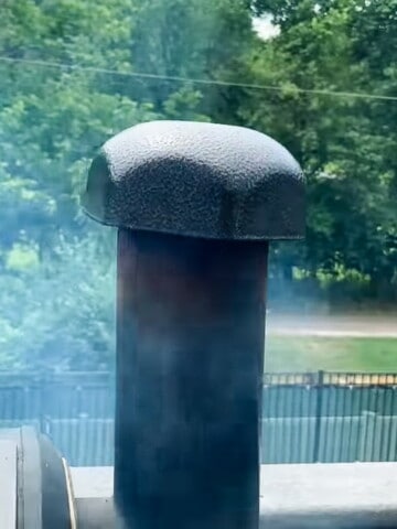 smoke coming out of a chimney on a pellet grill