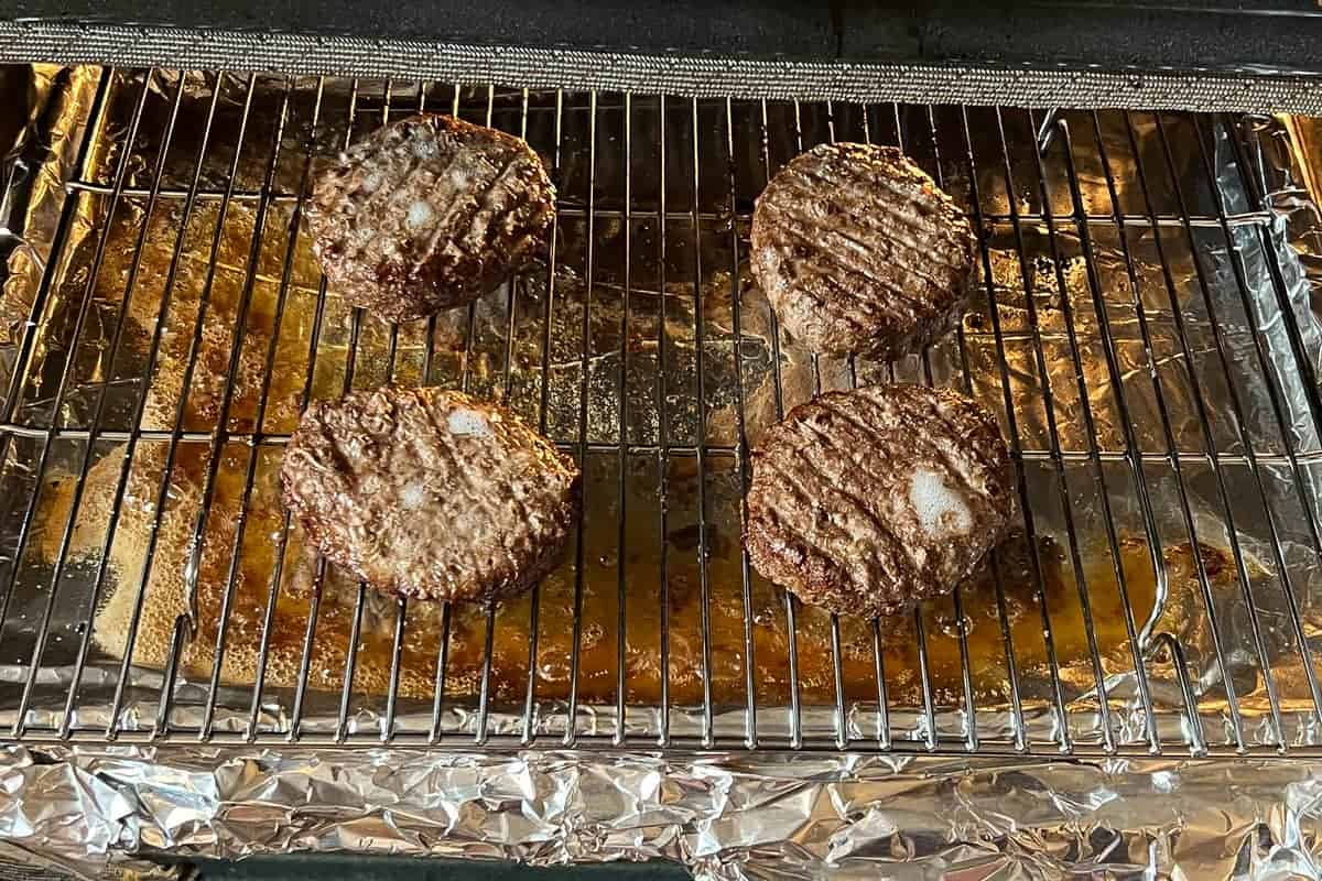 Hamburgers on a wire baking rack