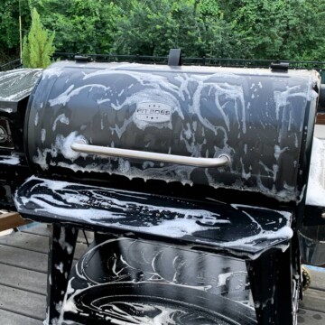 a Pit Boss pellet grill with sudsy soap all over it