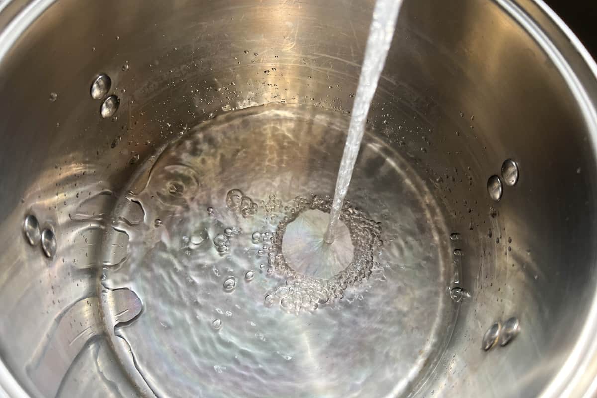 water being added to a stockpot