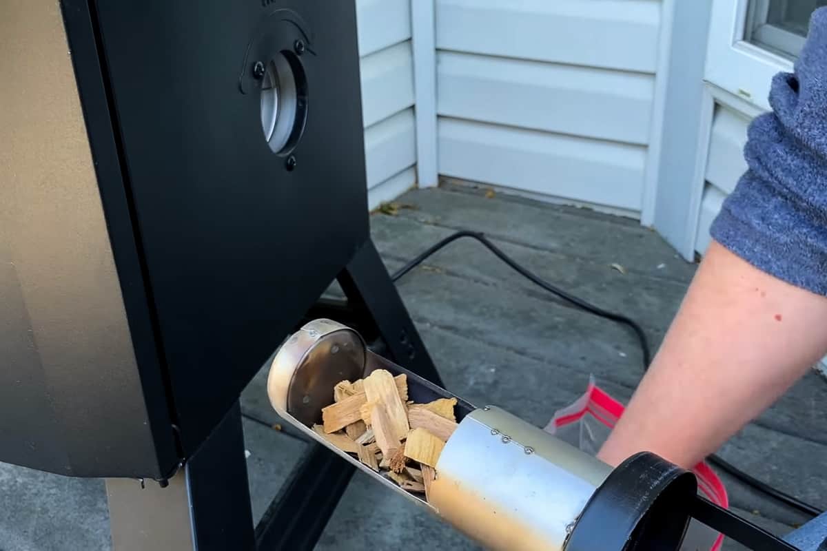 wood chips in the wood chip holder of a masterbuilt electric smoker