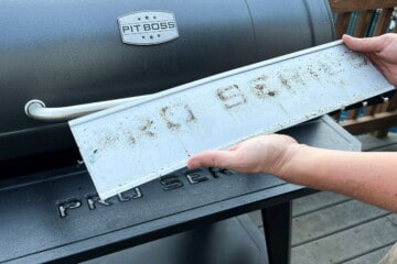 holding the metal backing that goes behind the words "PRO SERIES" on the front of the grill