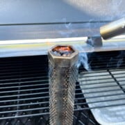 a blow torch lighting pellets in a pellet tube