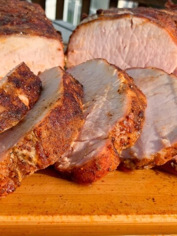 Pit Boss Smoked Pork Loin sliced on a cutting board