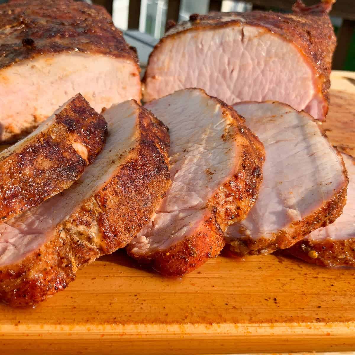 Pit Boss Smoked Pork Loin sliced on a cutting board