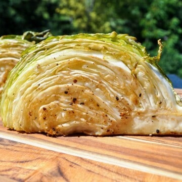 smoked cabbage cut open on a cutting board