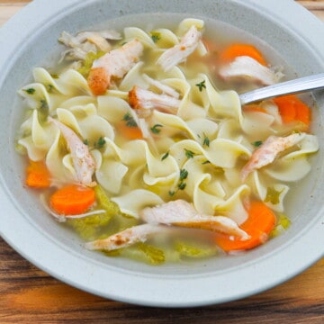 smoked turkey soup in a bowl with a spoon