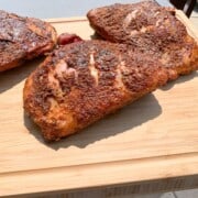 smoked turkey thighs on a cutting board