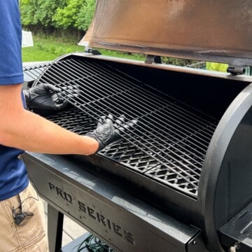 Mad's gloved hands installing the top rack into the Pit Boss Pellet Grill Pro Series 1150