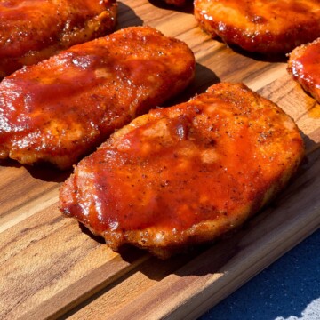 Smoked Boneless pork chops on a wood cutting board