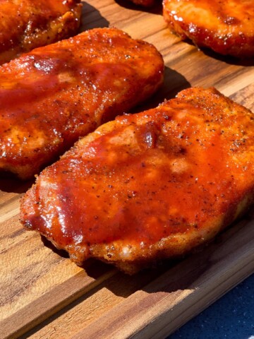 Smoked Boneless pork chops on a wood cutting board