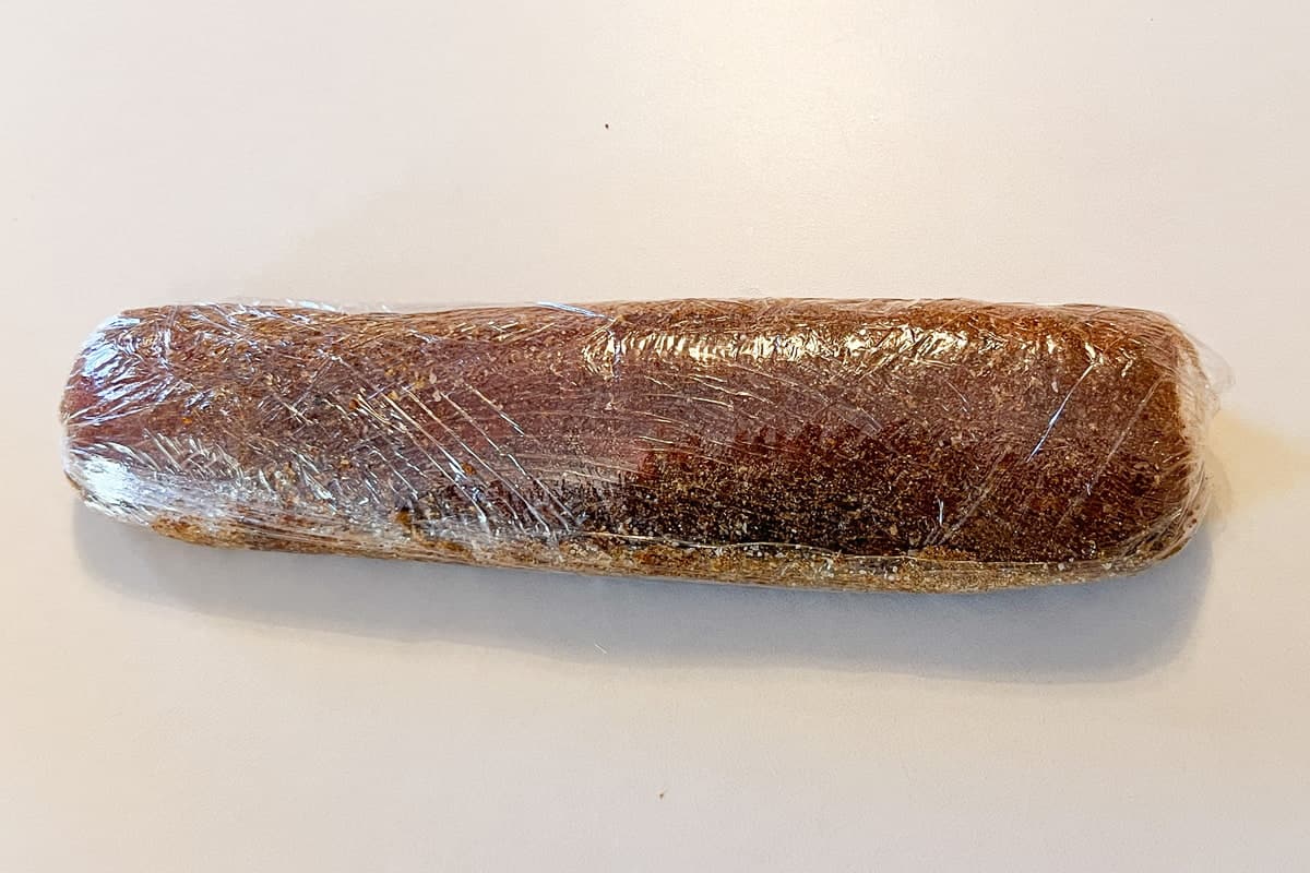 a pork tenderloin wrapped up in plastic wrap