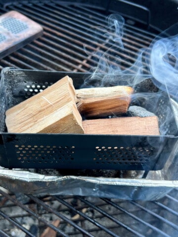 firebox filled with wood in an aluminum foil loaf pan
