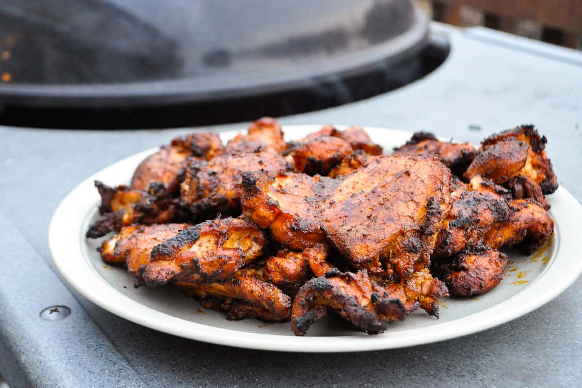 smoked boneless chicken thighs made on a charcoal grill