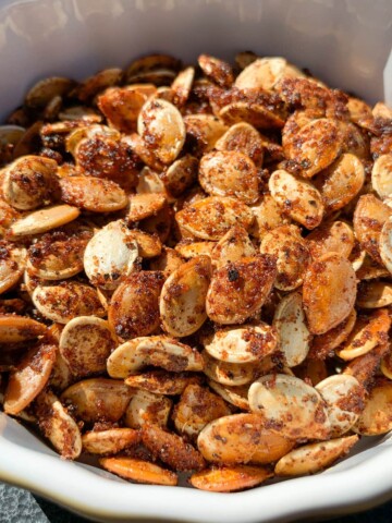 smoked pumpkin seeds in a small round dish